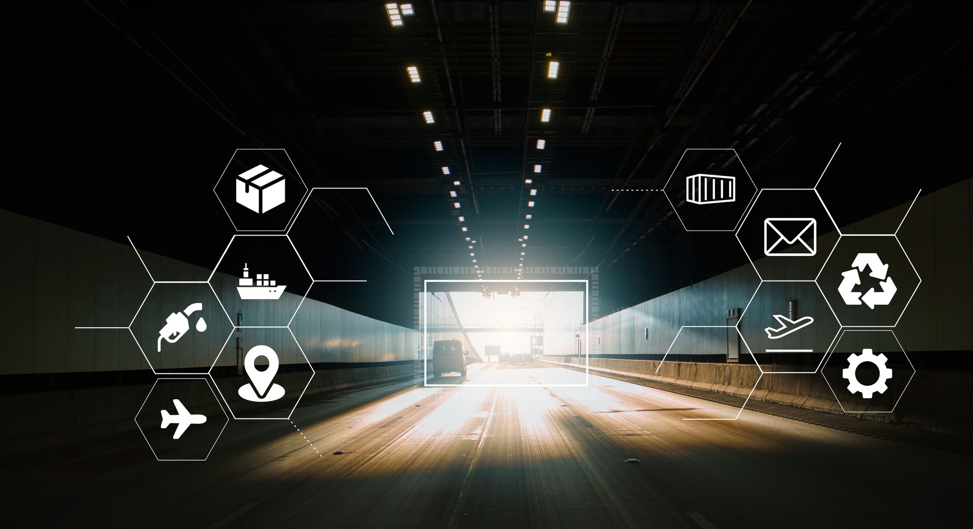 Driving forward in a motorway road tunnel towards the tunnel exit. Logistics and transportation concept. Electric vehicles and sustainability.